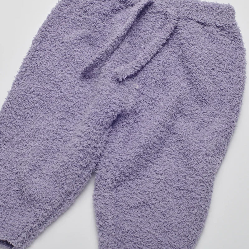 Soft, fuzzy knit lounge pants in a solid taro purple shade with an elastic waistband and matching drawstring.
