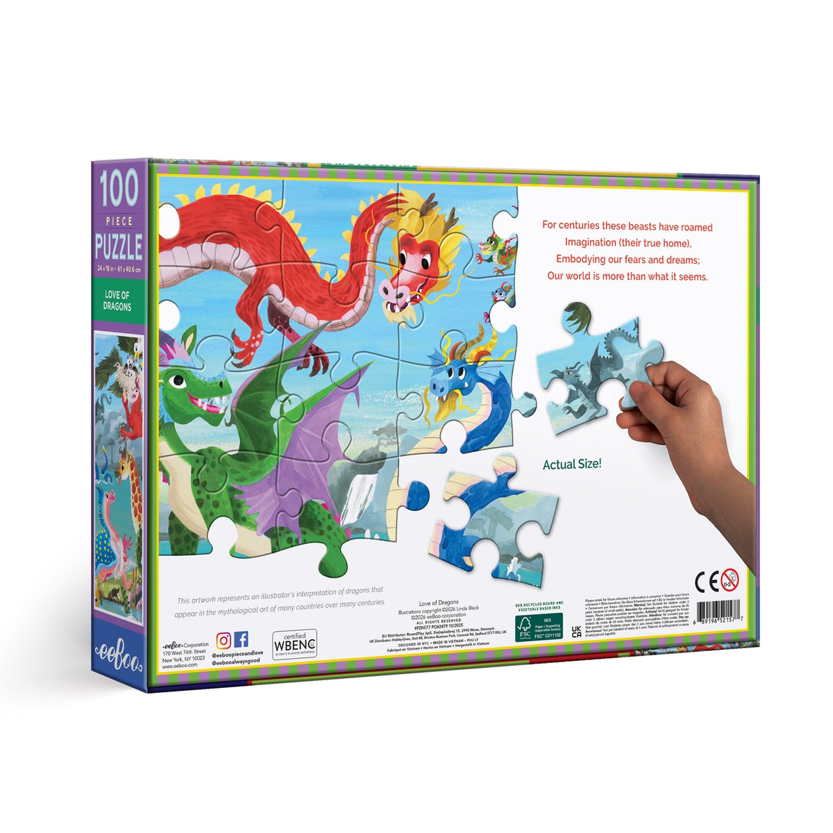 Jigsaw puzzle box with colorful dragons and a hand lifting a piece, on a white background