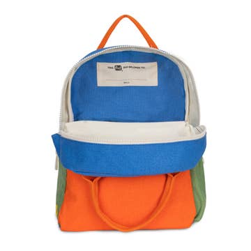 Colorful backpack with blue, orange, and green sections on a white background