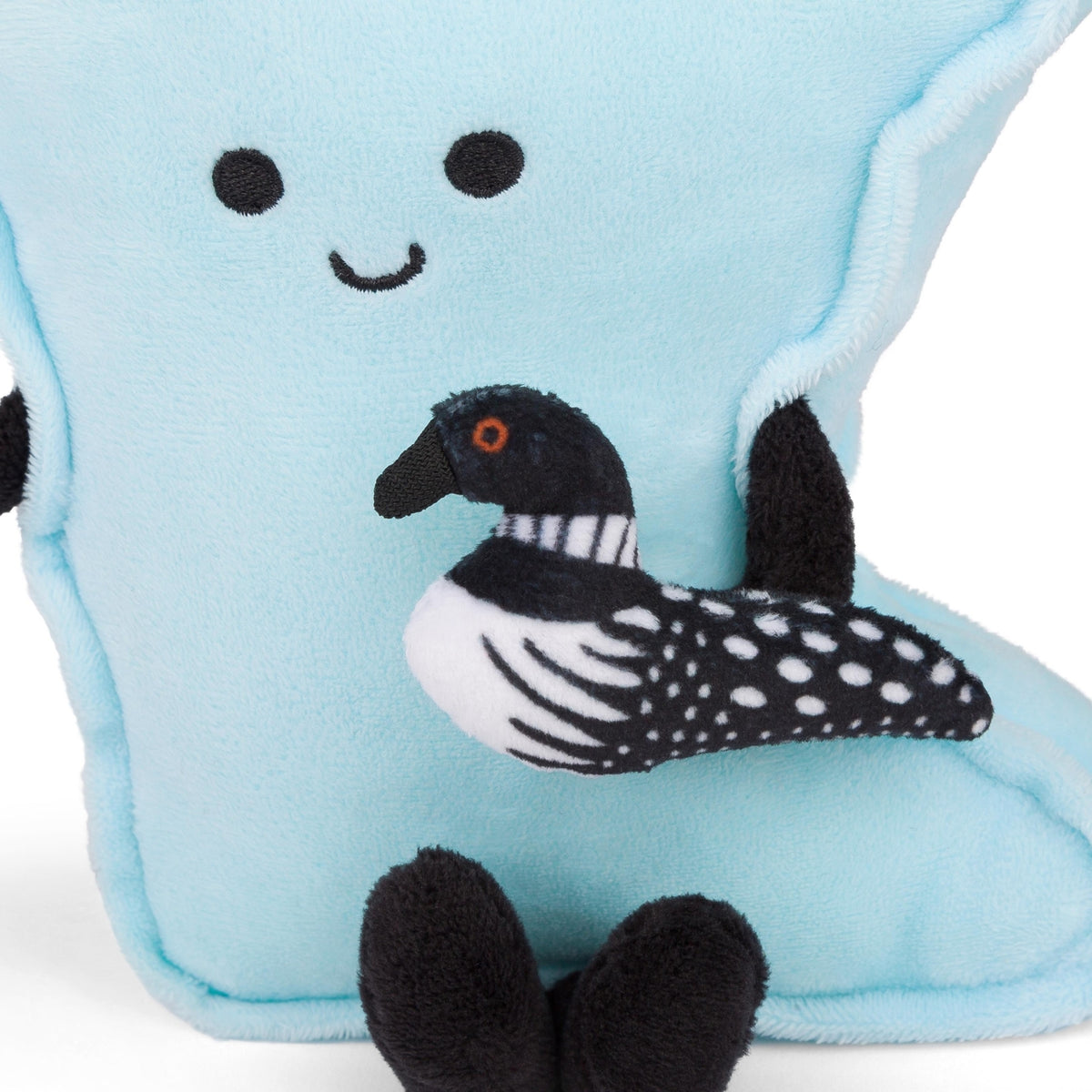 Plush toy with a loon on a light blue background