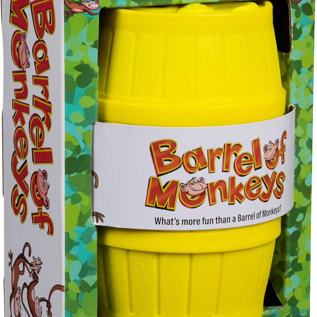 A product photo of the Barrel of Monkeys Game by Continuum Games featuring a bright yellow plastic storage barrel with the colorful classic game logo on a white and green jungle-themed cardboard packaging box.