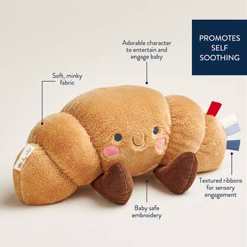 Plush toy with text highlighting features on a beige background