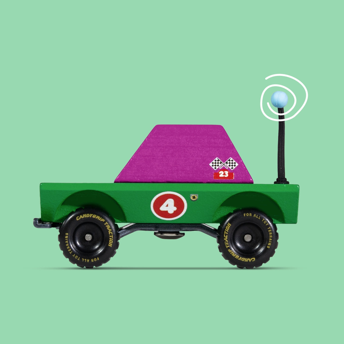Toy truck with a purple flatbed on a green background
