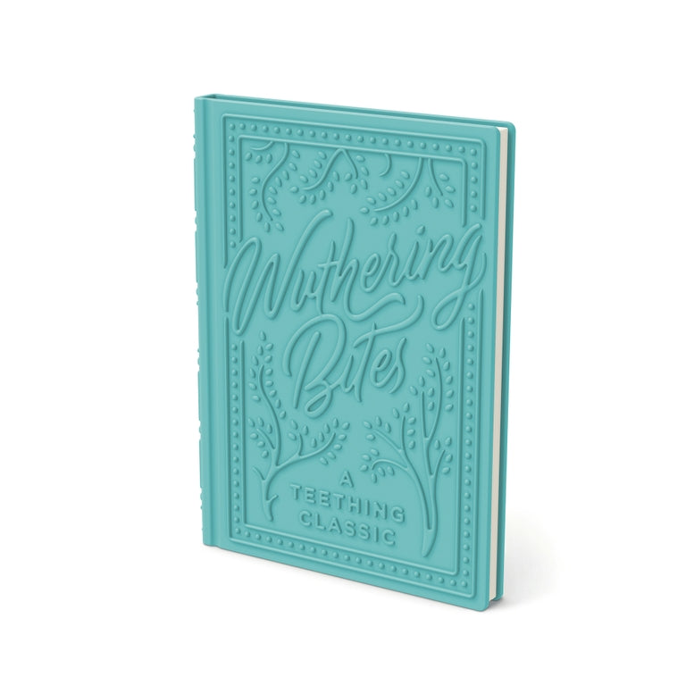 A turquoise hardcover book titled 'Mothering Bites: A Teething Classic' with embossed decorative border and script lettering on the front cover, shown on a clean white background.