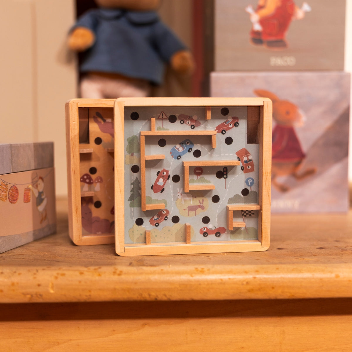 Wooden puzzle with letters and shapes on a wooden surface