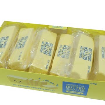 Box of Squeeze Toy Butter Unsalted with yellow packaging