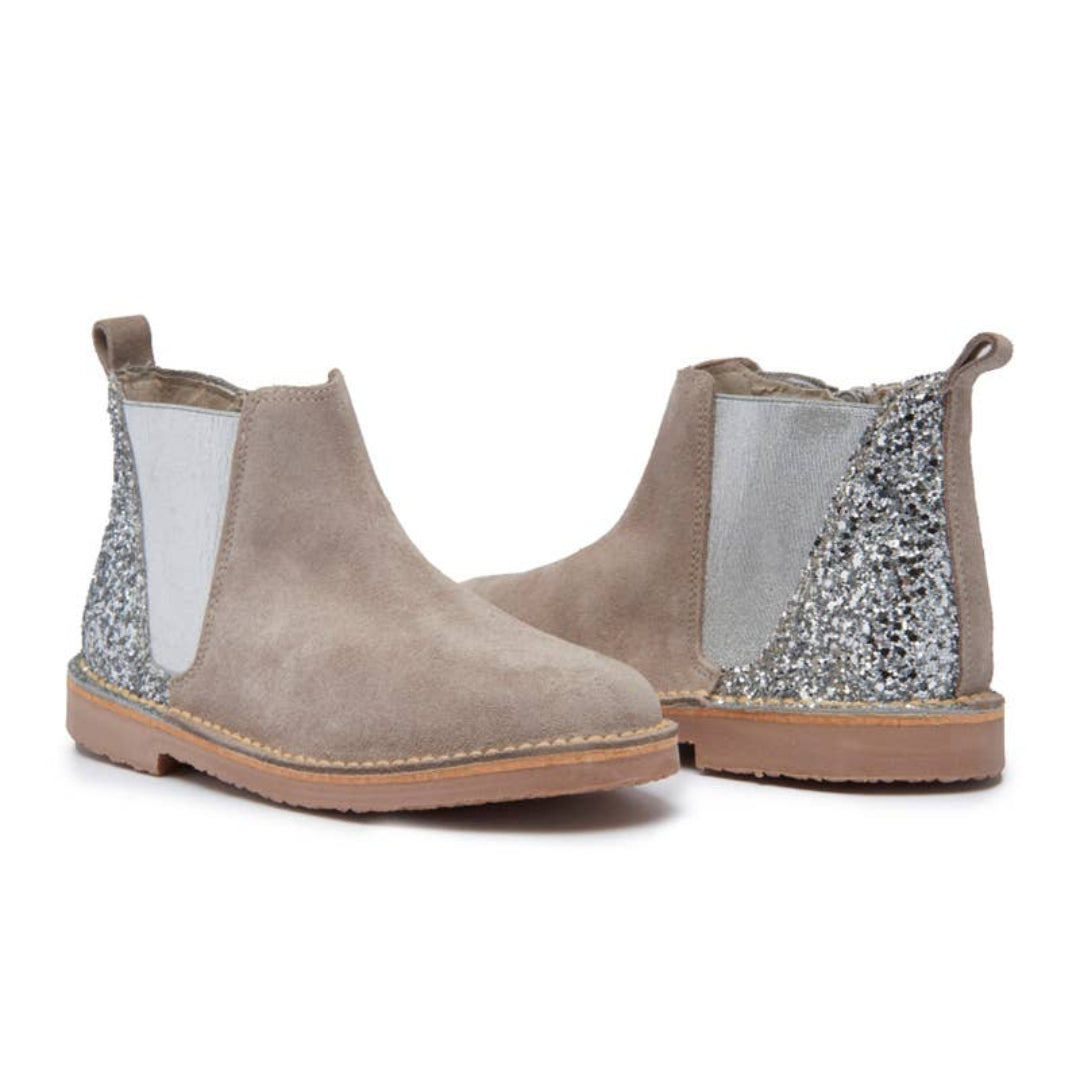 Pair of beige ankle boots with silver glittery panels on a white background