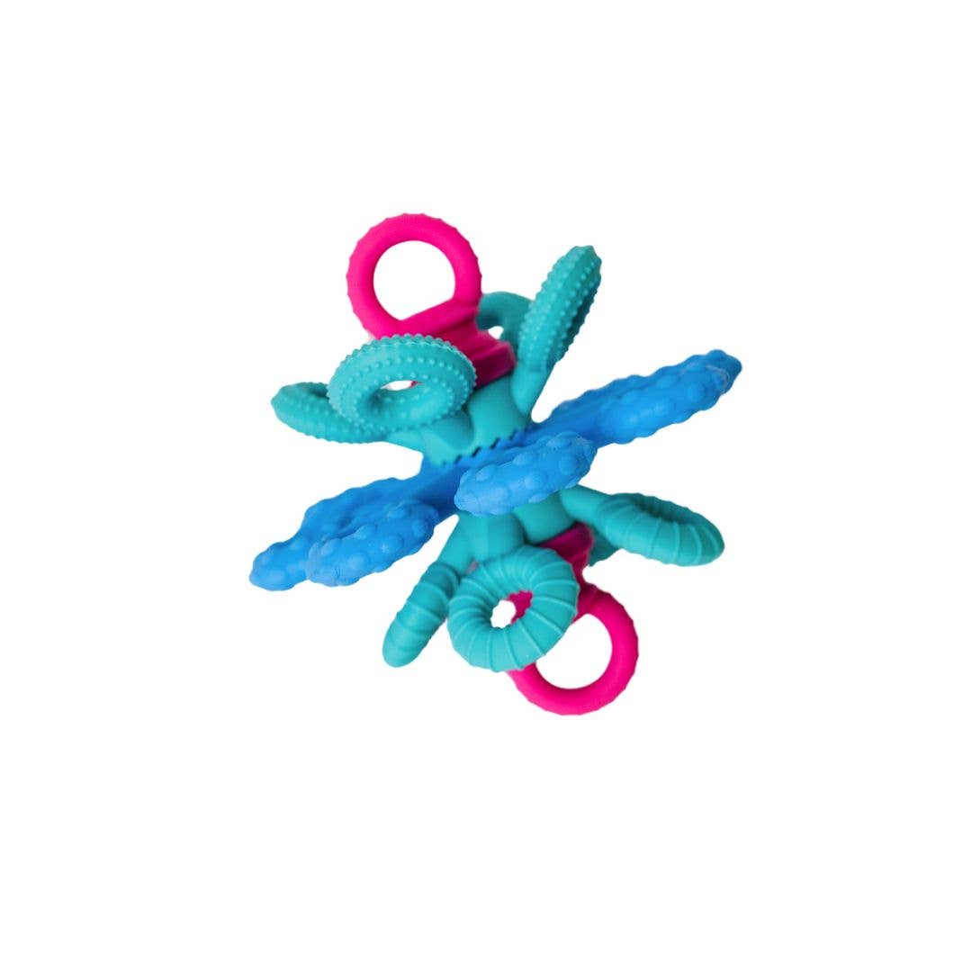 Teal and pink baby teething toy on a white background