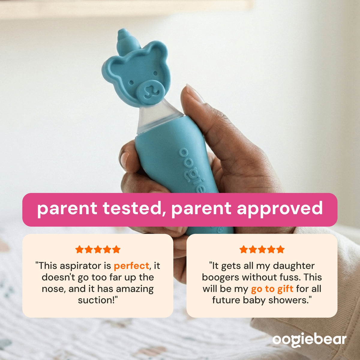 A hand holds a light blue Oogiebear aspirator with a bear-shaped tip against a softly blurred indoor background. Prominent text overlays read 'parent tested, parent approved' with two customer review cards below.