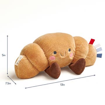 Plush toy caterpillar with size measurements on a white background