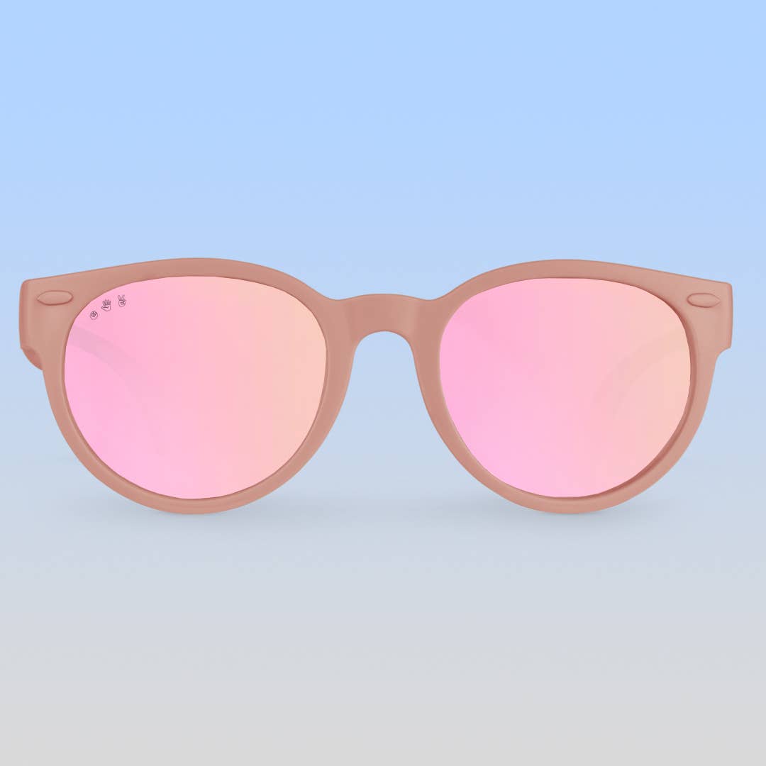 Sunglasses with pink gradient lenses and brown frames on a white background