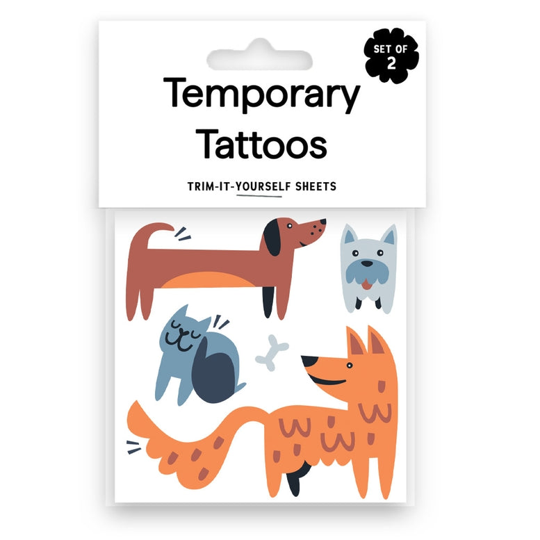 Pack of temporary tattoos featuring cute cartoon pet illustrations including a dachshund, terrier, cat, and fox, in orange, brown, blue, and black colors.