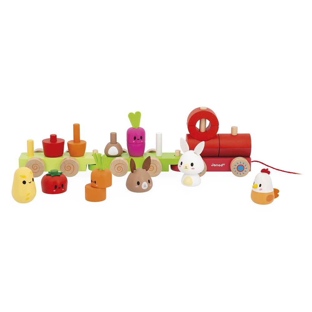 Children's toy set with a red wagon, animals, and vegetables on a white background