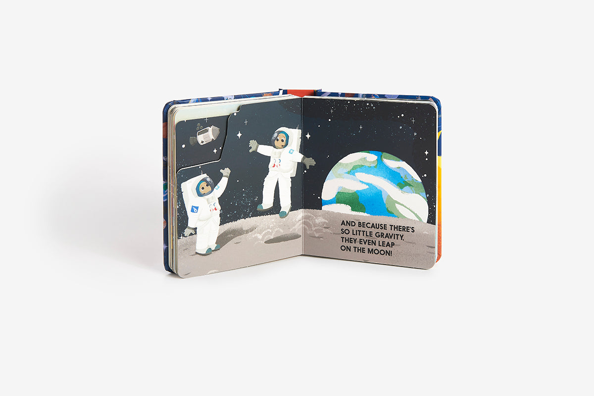 Children's book with space-themed illustrations of astronauts on the moon.