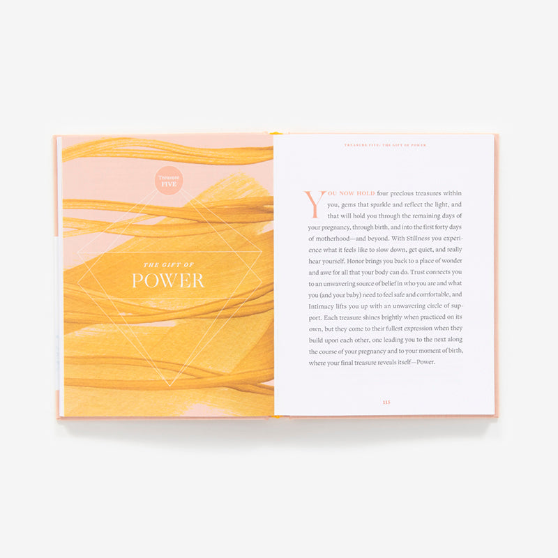 Open book with yellow marbled pages and white text on a white background