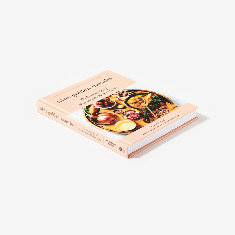 Cookbook titled 'The Golden Moment' on a white background