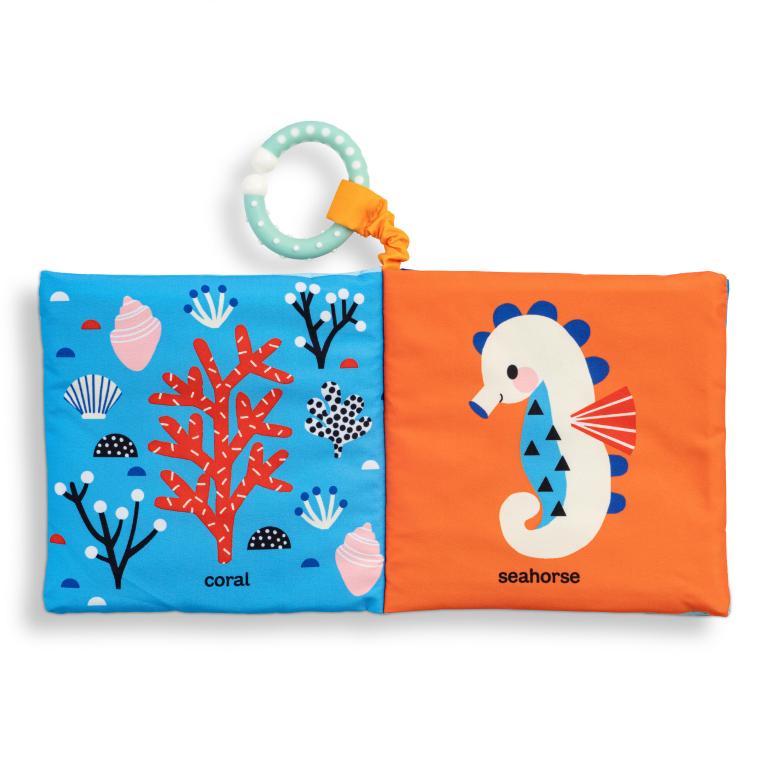 Children's soft book with ocean-themed illustrations on a white background