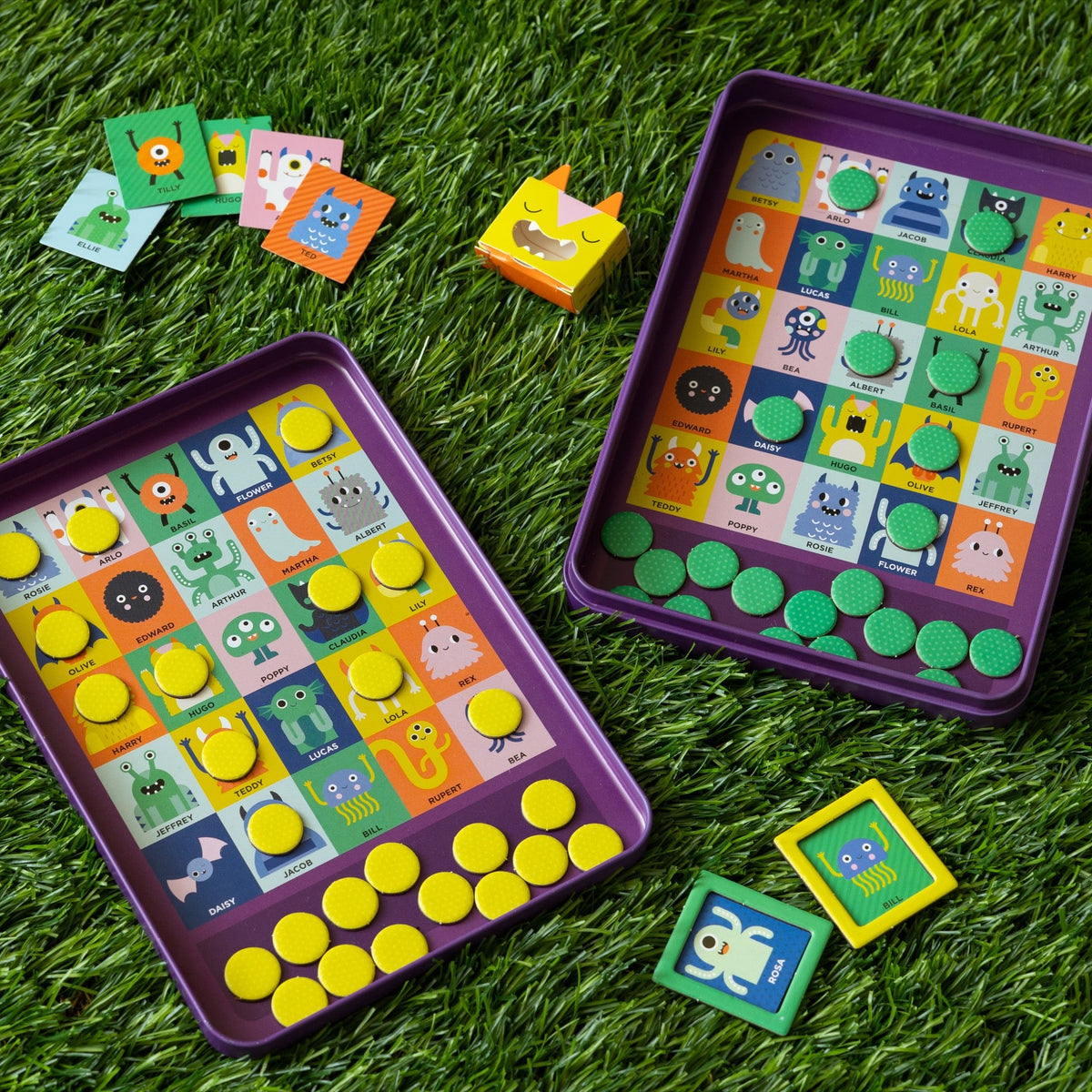 Colorful educational game with character buttons on a grassy background