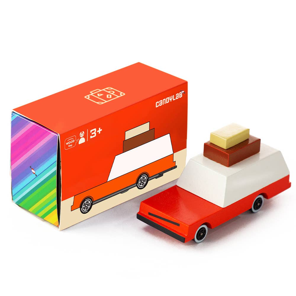 Wooden toy truck with a colorful box on a white background