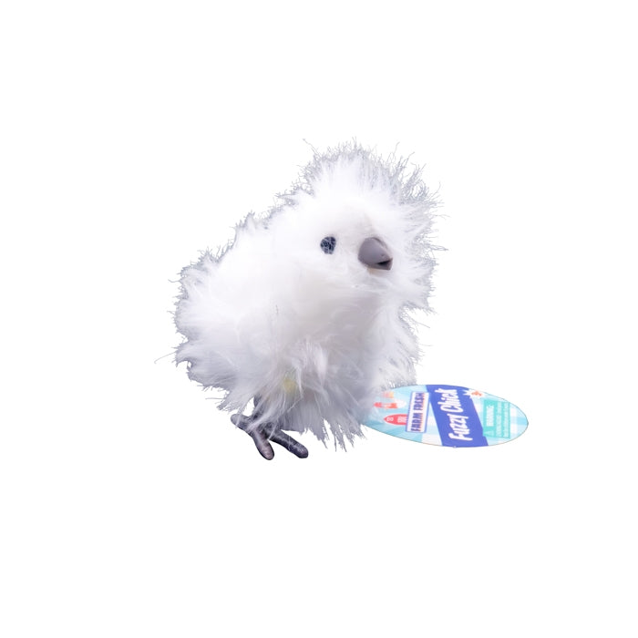 White fluffy toy with a blue and yellow tag on a white background
