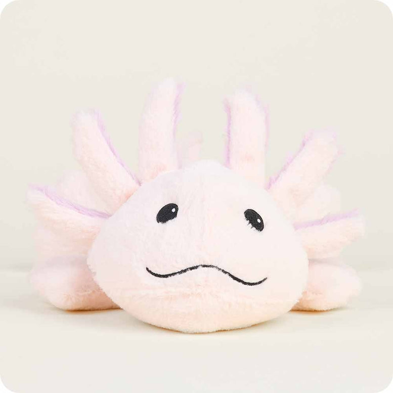 A close-up shot of the Pink Axolotl by Warmies plush toy against a plain background, highlighting its soft pink face, stitched eyes and mouth, and fluffy external gills.