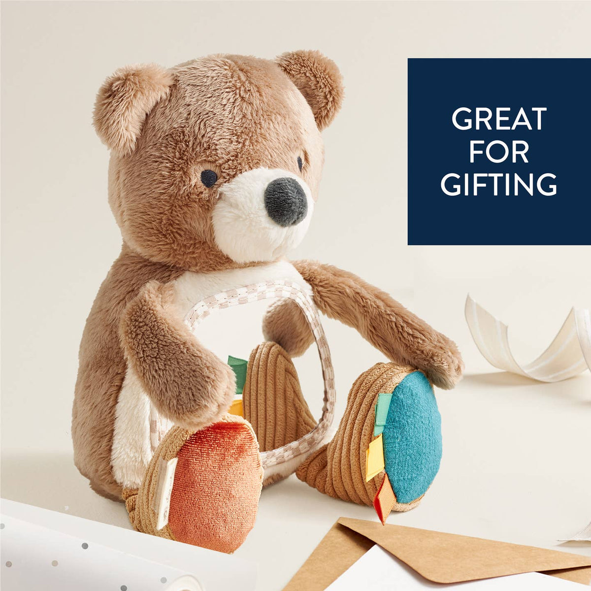 Plush toy with activity center on a light background, labeled 'Great for Gifting'.