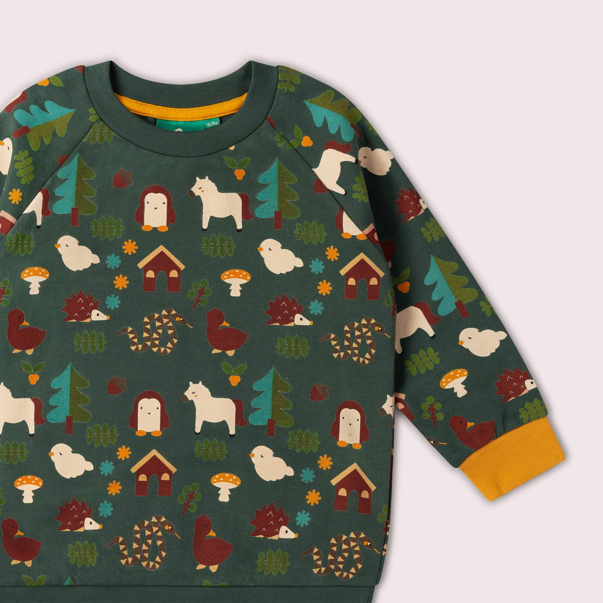 Children's sweater with forest animal pattern on a light gray background