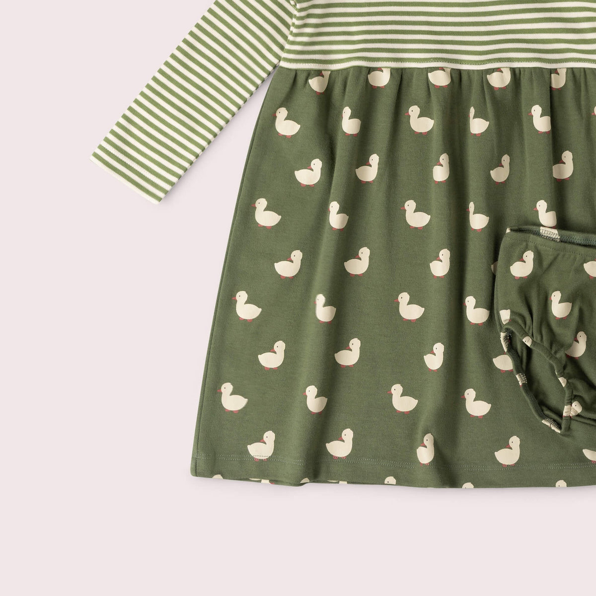 A two-piece baby girl's outfit set featuring a long-sleeve dress and matching bloomers. The dress has a top section with green and white horizontal stripes and a bottom section in olive green with a repeating duck print.