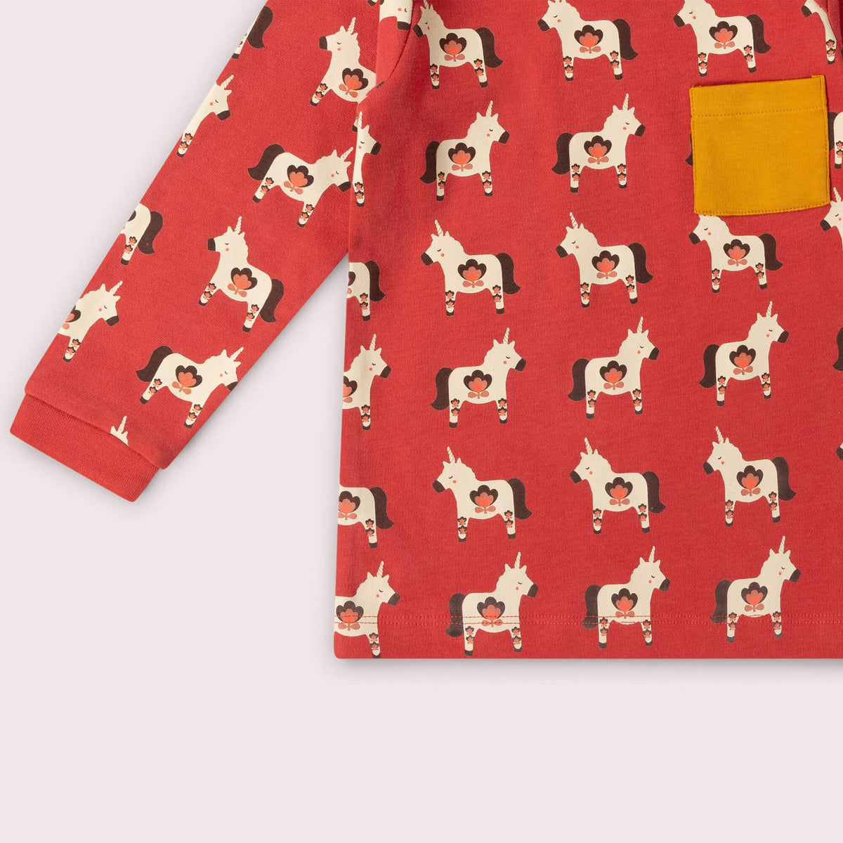 Red pajama set with unicorn pattern on a white background