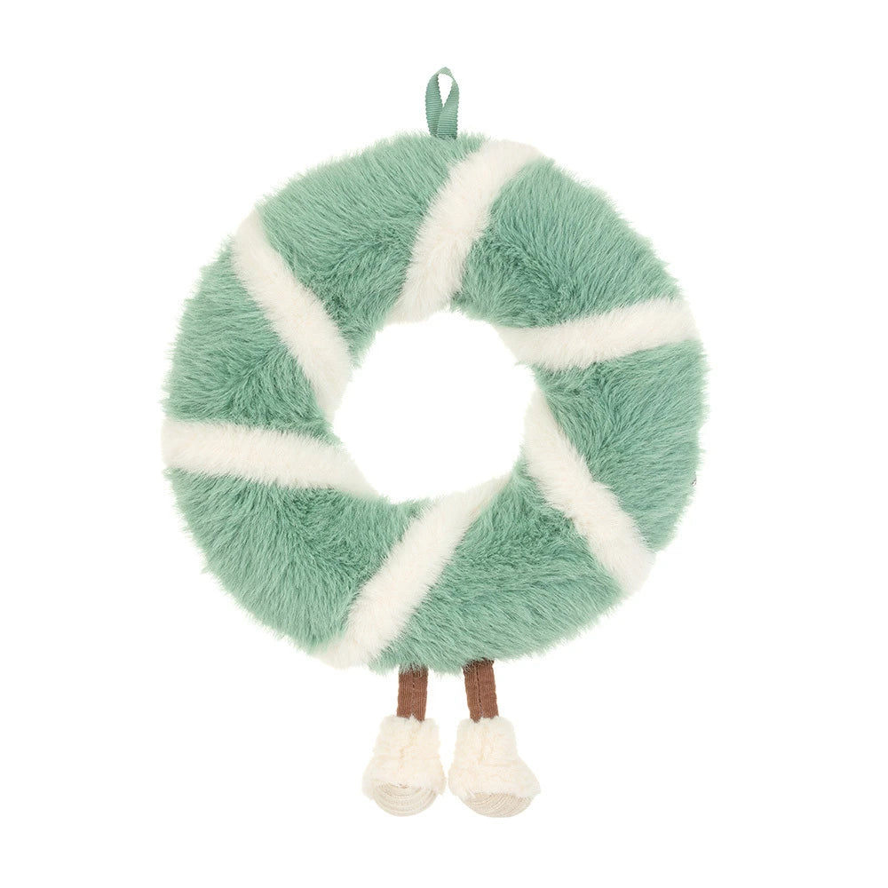 A plush donut-shaped hanging decoration in mint green and white faux fur, shown on a plain white background.