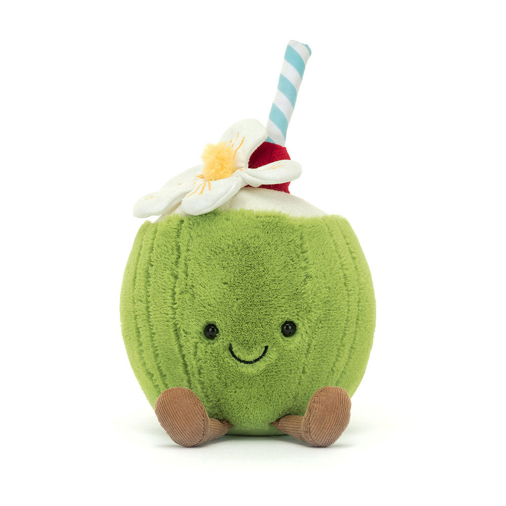A plush toy in the shape of a green coconut with a smiling face, a red and white striped straw, and a white flower on top.