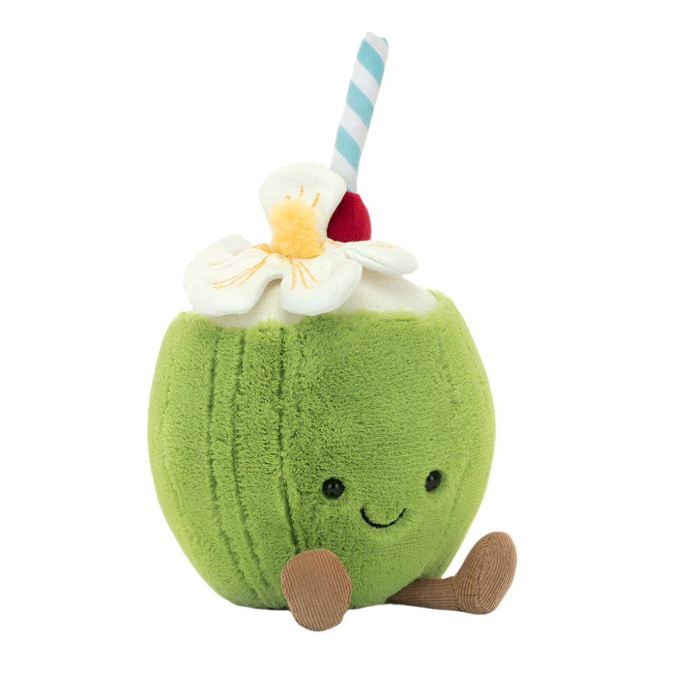 A plush toy in the shape of a green coconut with a smiling face, a red and white striped straw, and a white flower on top.