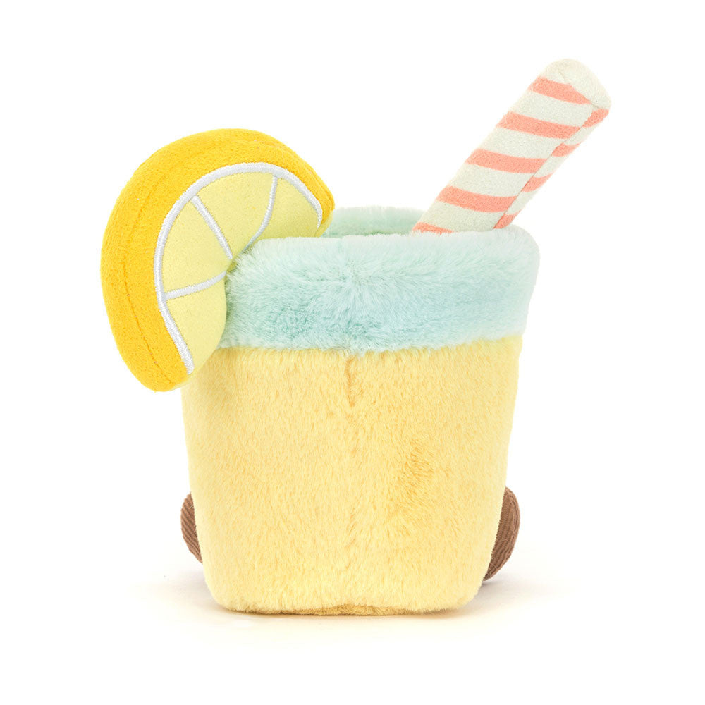 A plush toy resembling a glass of lemonade with a lemon slice and a straw, smiling face at the bottom.