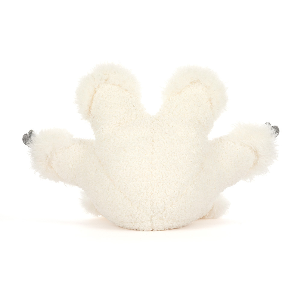 White plush toy sloth on a white background