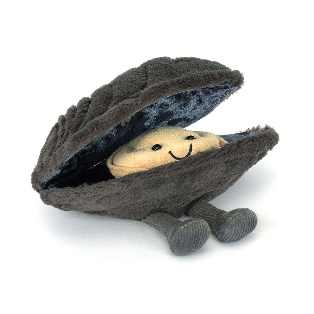 Plush toy inside a shell with a smiling face on a white background