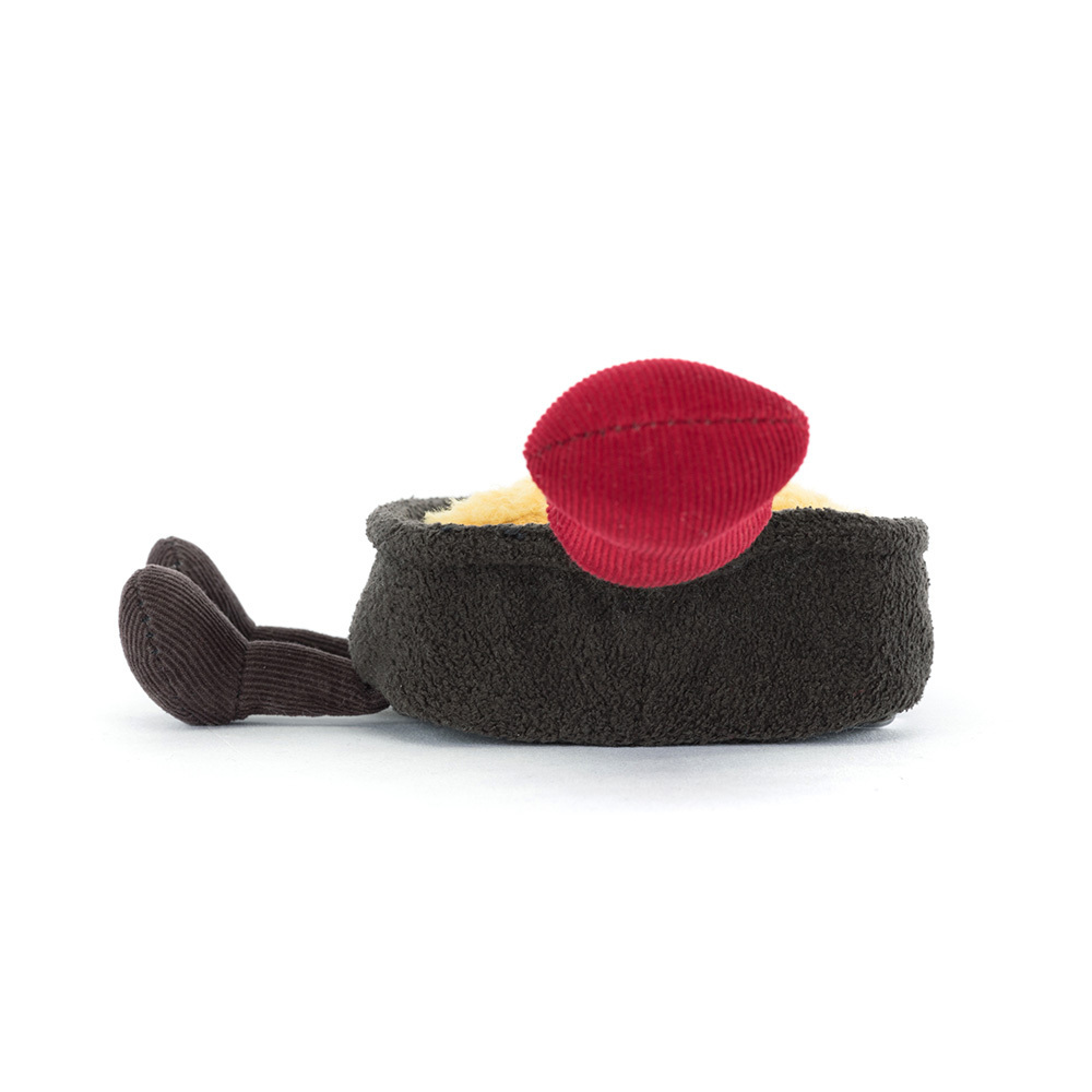 Small plush toy resembling a bowl with a red lid on a white background