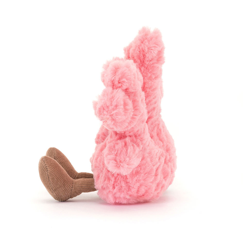 Pink plush bunny toy on a white background