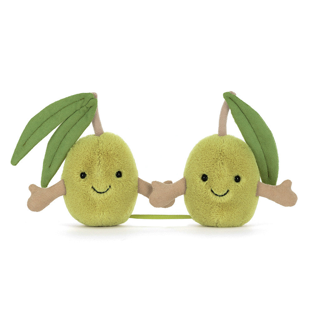 Two plush avocado toys holding hands on a white background
