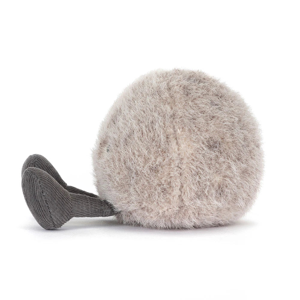 Fluffy gray ball with ribbed texture on a white background