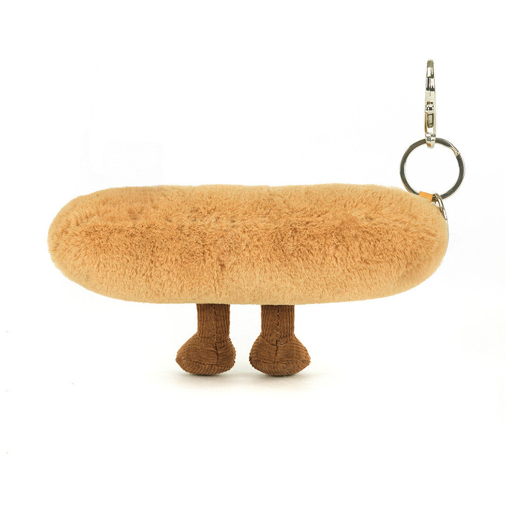 Plush keychain shaped like a dog with a bone on a white background