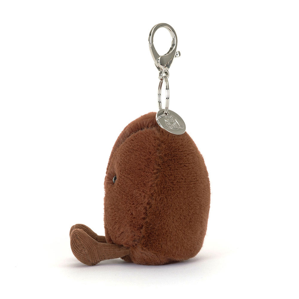 Brown plush keychain with a clip on a white background