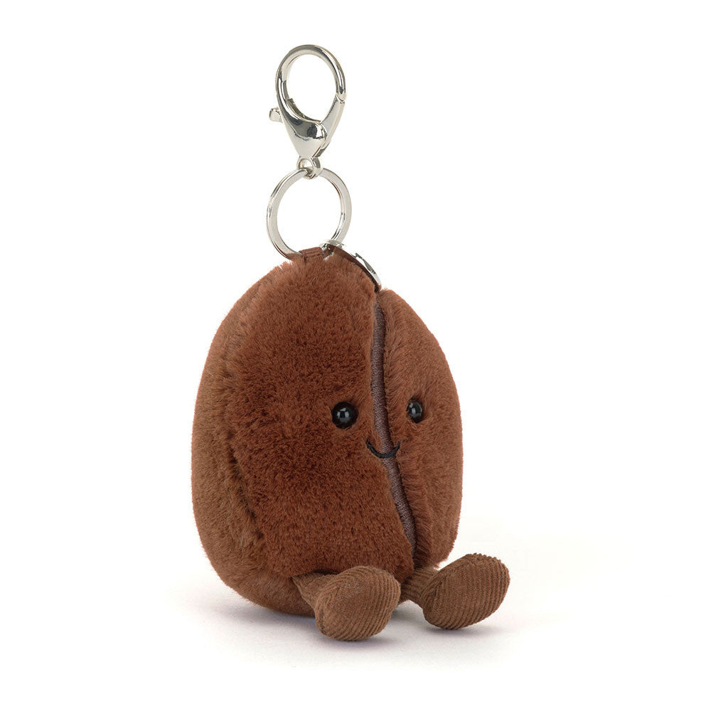 Plush coffee bean keychain with a smiling face on a white background