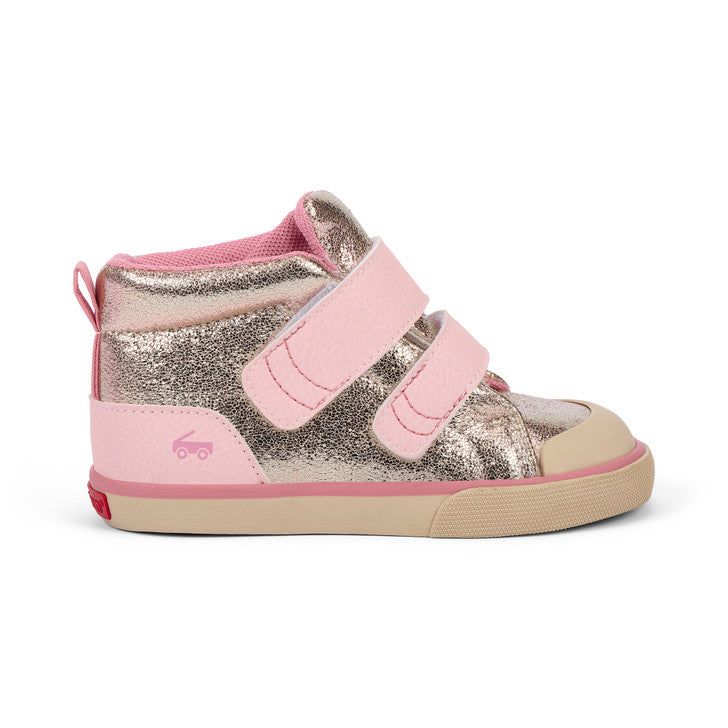 Pink and silver children's shoe on a white background