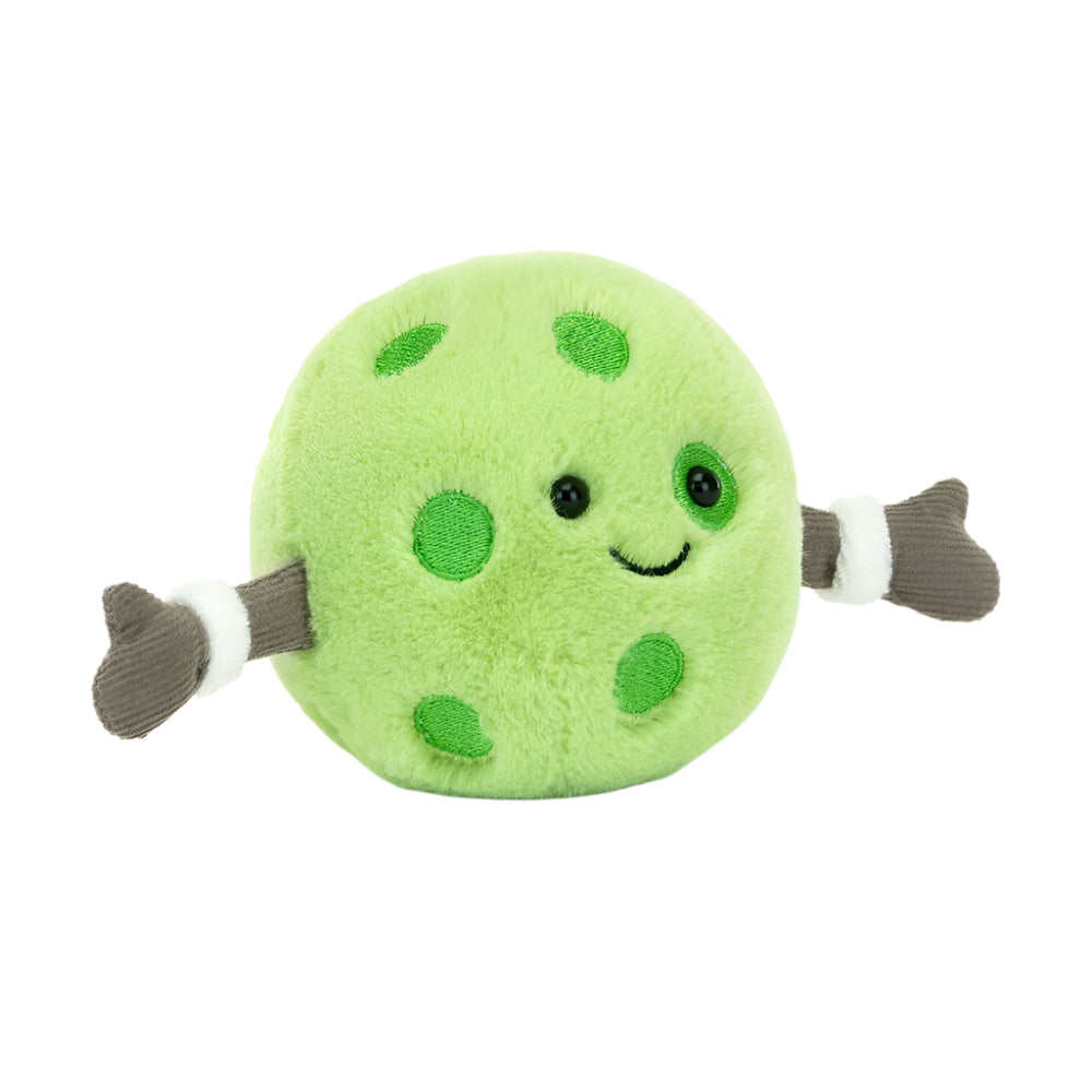 A plush toy resembling a green pickleball with arms and a smiling face.