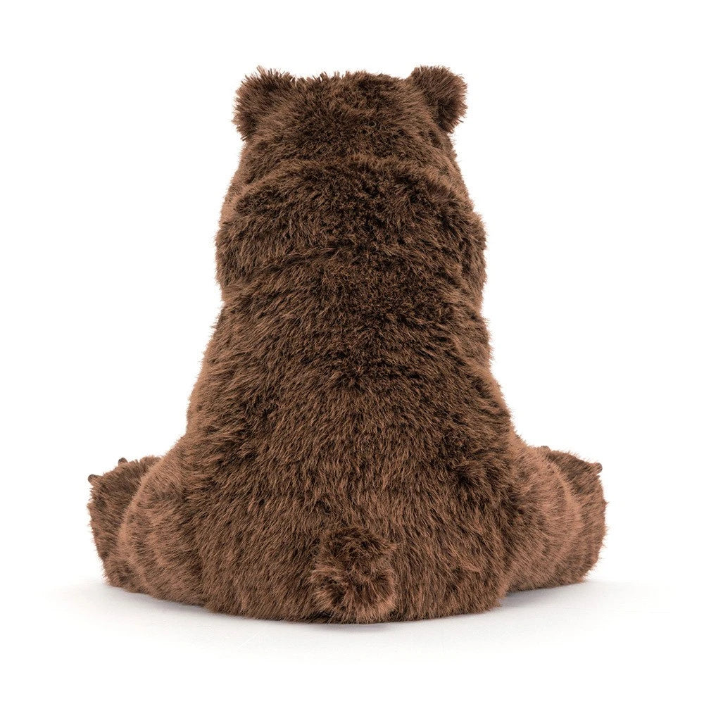 A brown plush teddy bear toy shown from the back, sitting down, on a clean white background.