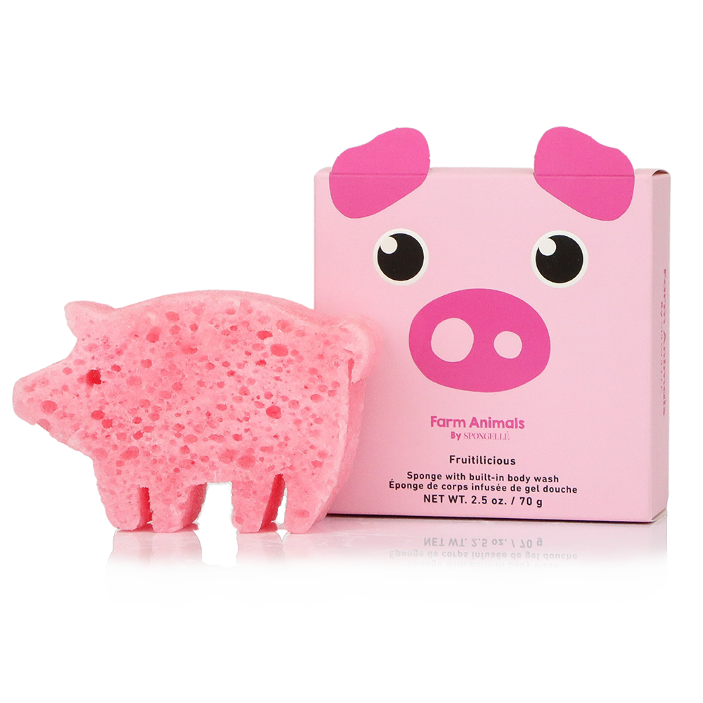 Pink pig-shaped sponge body wash next to its pink packaging box featuring a cartoon pig face. The box is labeled 'Farm Animals BY NINJAJIRI' and 'Fruitliclass'.