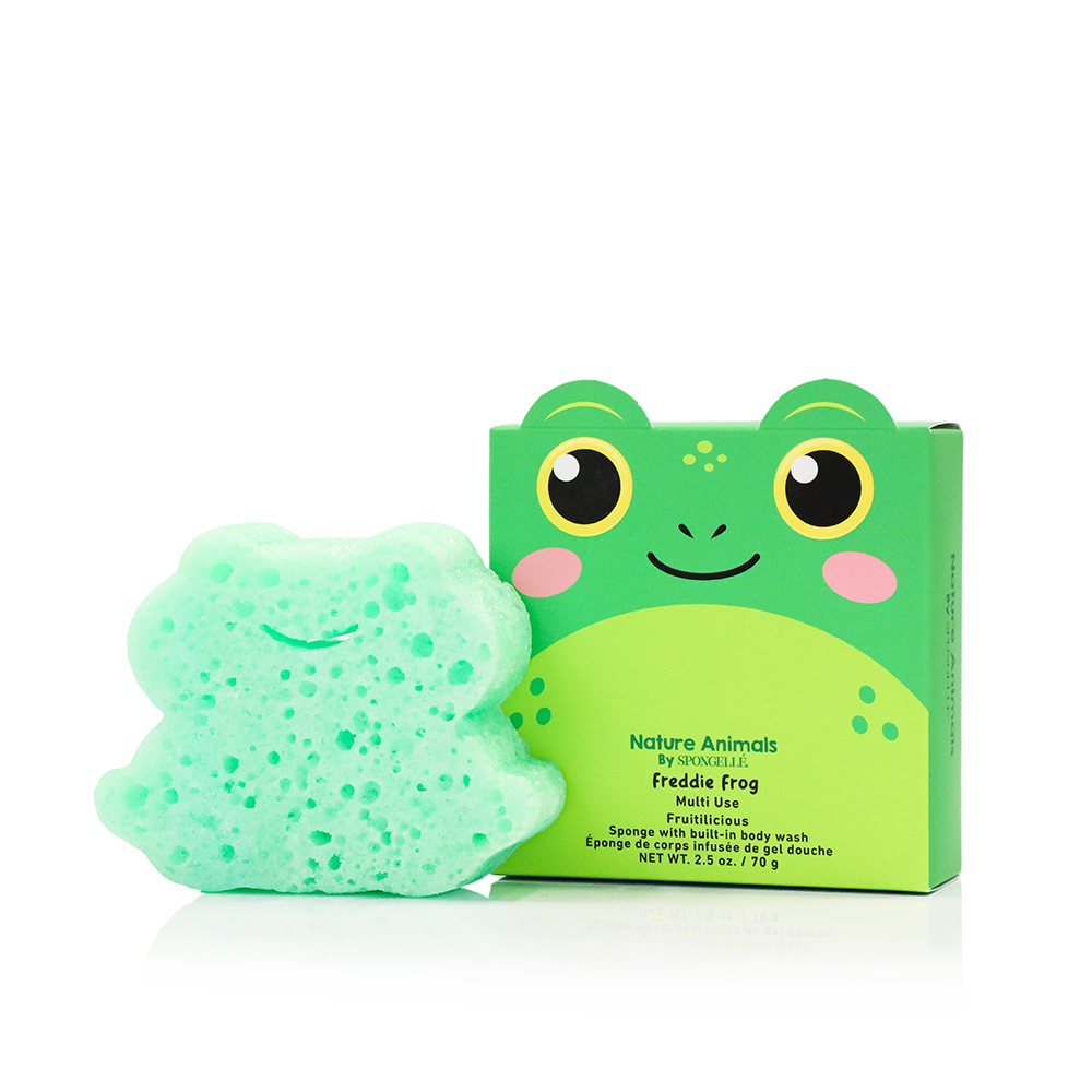 A green frog-shaped sponge next to its matching green packaging box, both featuring a cartoon Freddy Frog design with yellow eyes and pink cheeks on a white background.