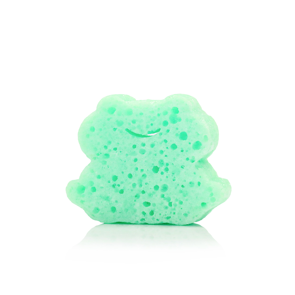 Green bath bomb shaped like a bear on a white background
