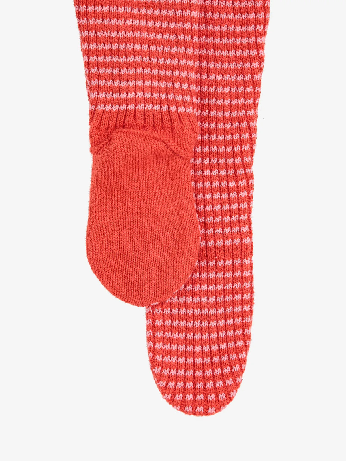 Close-up of a red and white textured sock on a white background