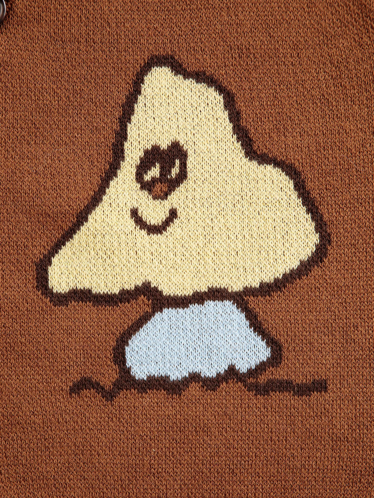 Knitted design of a ghost on a brown background